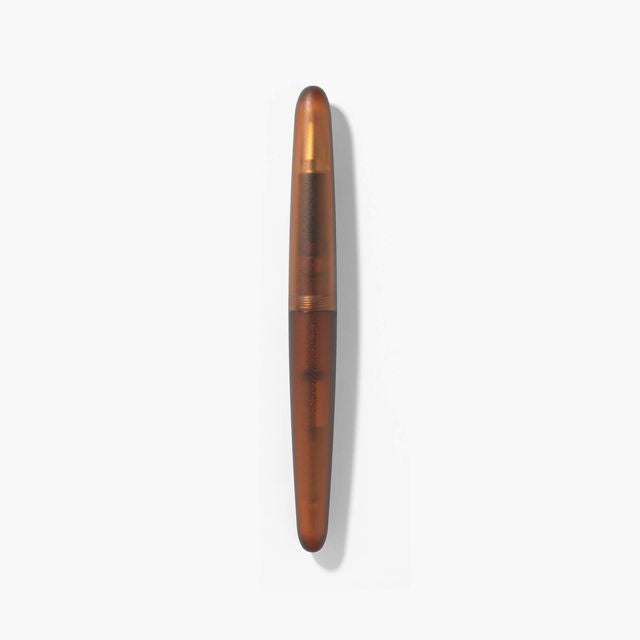 A pen that evokes the texture of frosted glass. Its translucency reveals the internal mechanism as an aesthetic feature. Careful consideration of form and colour palette ensures an elegant presence, even when not in use.
The pen is equipped with thoughtful functionality, including an extended grip section and a screw cap designed for quick access with minimal turns. The visible ink level allows for easy refills.
Available in a Fine and Medium nib
Includes converter
Steel nib