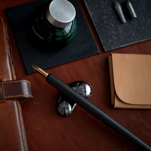 Our Hasami ware pen rests are inspired by the natural form of droplets. Four distinctive colours have been specially selected from an extensive variety of glazes. The soft contours gently guide and hold your pen in place.
Four colours were chosen to celebrate the unique richness of Hasami porcelain and glazes.
The golden glaze has an unassuming presence when raw. The unique and variable nature of pottery work is evident here with the finished colouring dictated by the position inside the kiln and revealed