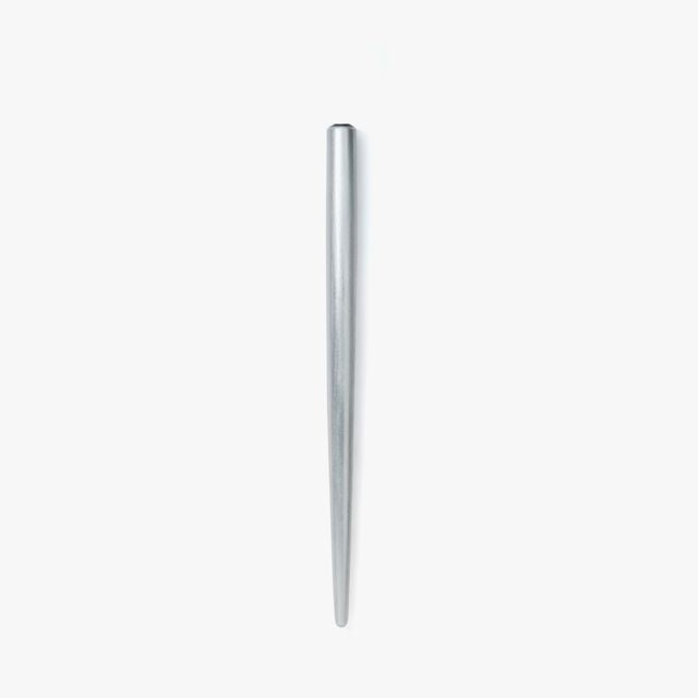 A nib holder that emerged from our desire to create a tool that inspires a lifetime of use, bringing joy to our hands and soul. From the timeless material to the comfortable thickness, form and length, each and every detail has been carefully considered to create a perfect fit. The 7-inch length is similar to that of a standard pencil. Designed to universal specifications to fit all standard nibs, the nib holder will travel with you for a lifetime of writing.
A nib holder machined from solid aluminiu