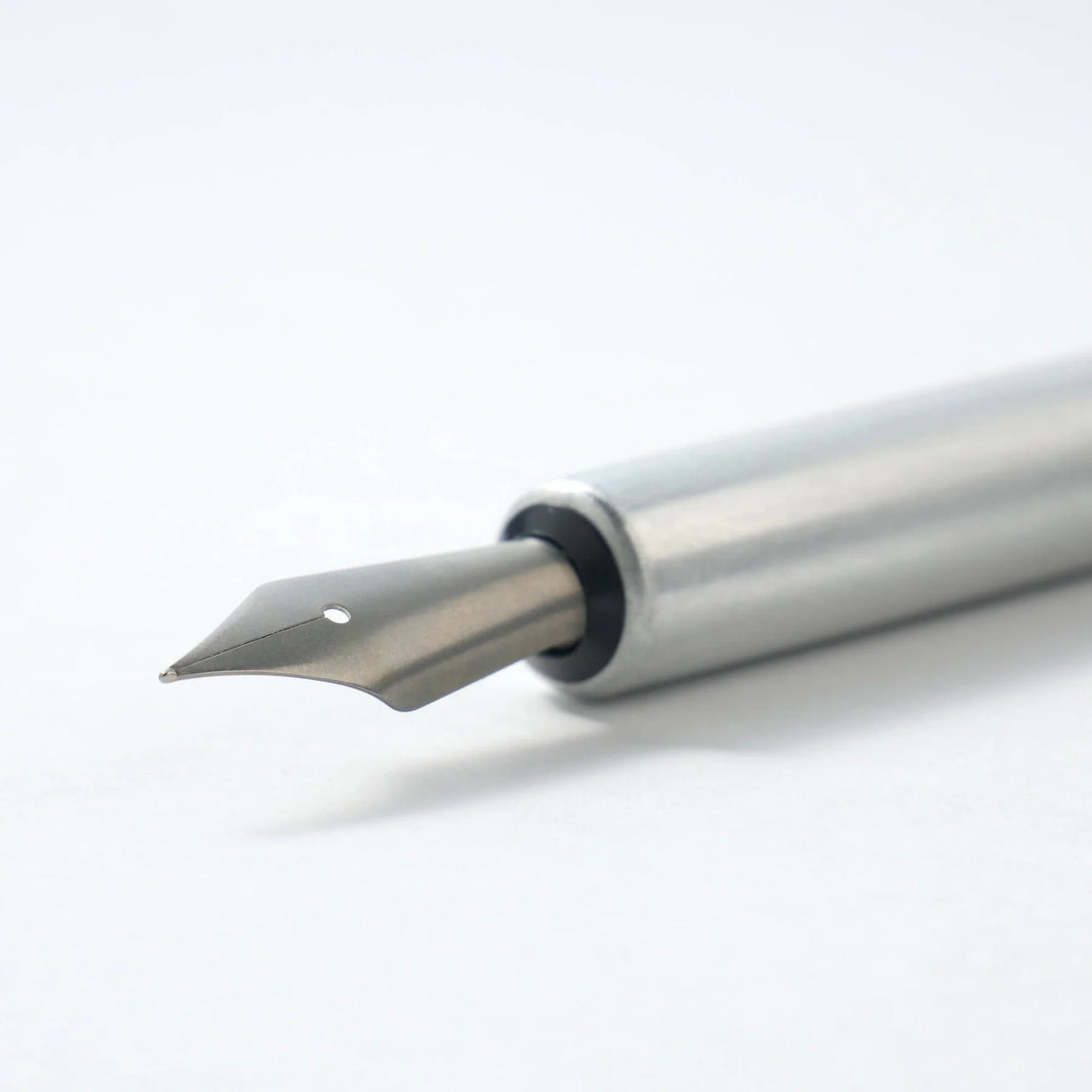 A nib holder that emerged from our desire to create a tool that inspires a lifetime of use, bringing joy to our hands and soul. From the timeless material to the comfortable thickness, form and length, each and every detail has been carefully considered to create a perfect fit. The 7-inch length is similar to that of a standard pencil. Designed to universal specifications to fit all standard nibs, the nib holder will travel with you for a lifetime of writing.
A nib holder machined from solid aluminiu