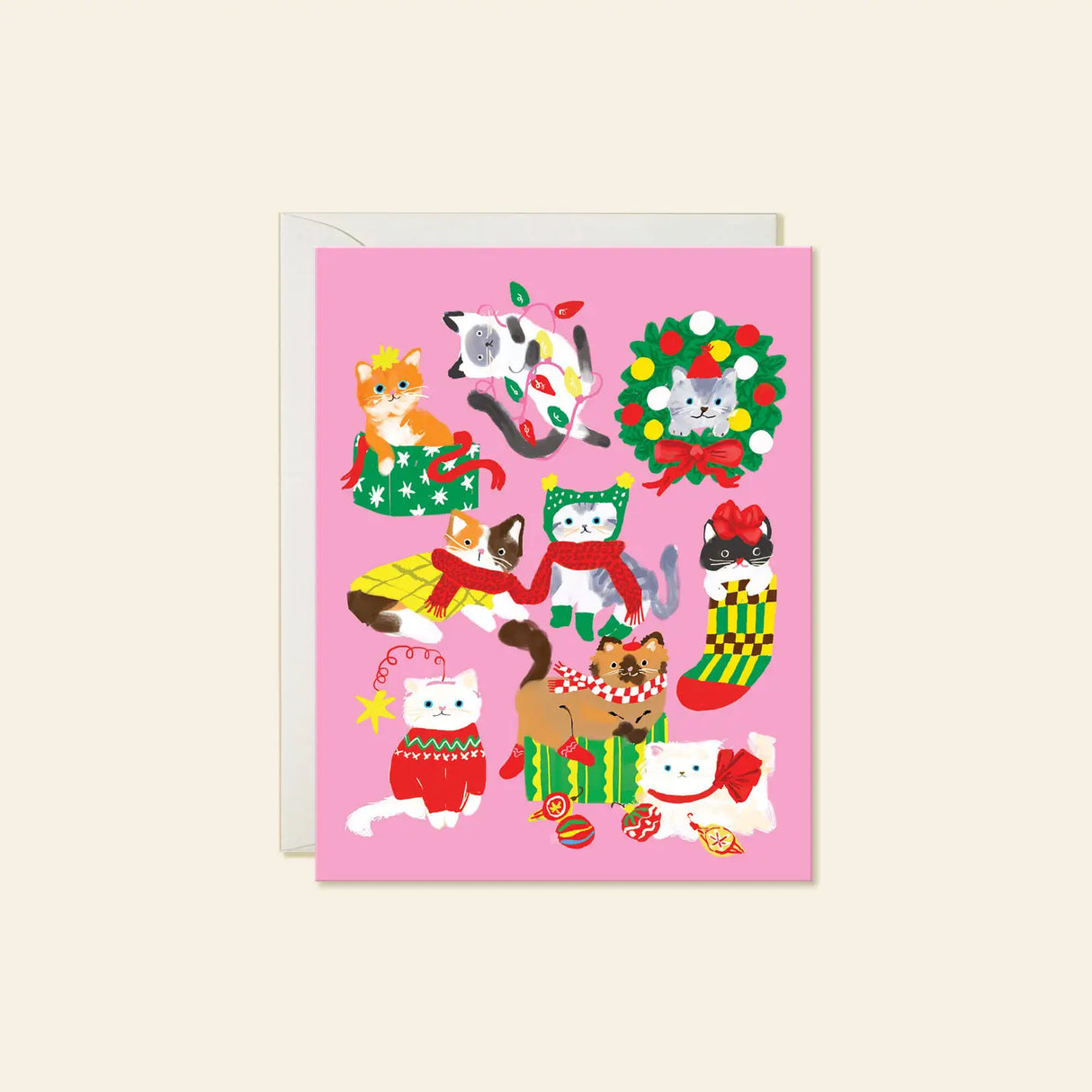Karen Schipper Greeting Card - Christmas Cats
A pink holiday scene packed with cats in sweaters, scarves, stockings, bows, lights, and gift boxes makes this design feel instantly merry. This hand-illustrated Christmas Cats holiday card brings together playful feline characters and festive details, making it a cheerful pick for cat lovers and those who want a Christmas card with extra personality.
A2 folded card, 4.25" W × 5.5" L
Printed in full color on FSC® certified white cover paper
Blank interior
Sin