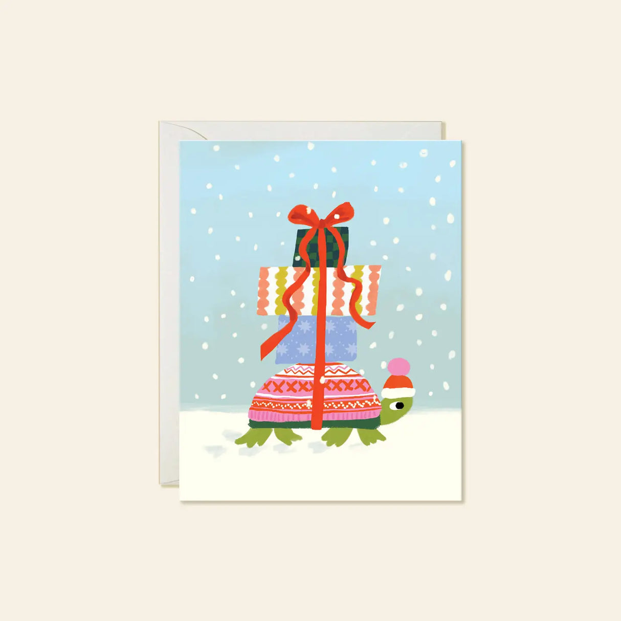 Karen Schipper Greeting Card - Winter Turtle
A tiny turtle carrying a towering stack of presents makes this winter scene feel sweet, cheerful, and full of charm. This hand-illustrated Winter Turtle holiday card features a bundled-up turtle in a festive hat, wrapped gifts tied with a bright red ribbon, and soft falling snow for a whimsical seasonal design that feels easy to love.
A2 folded card, 4.25" W × 5.5" L
Printed in full color on FSC® certified white cover paper
Blank interior
Single greeting card +
