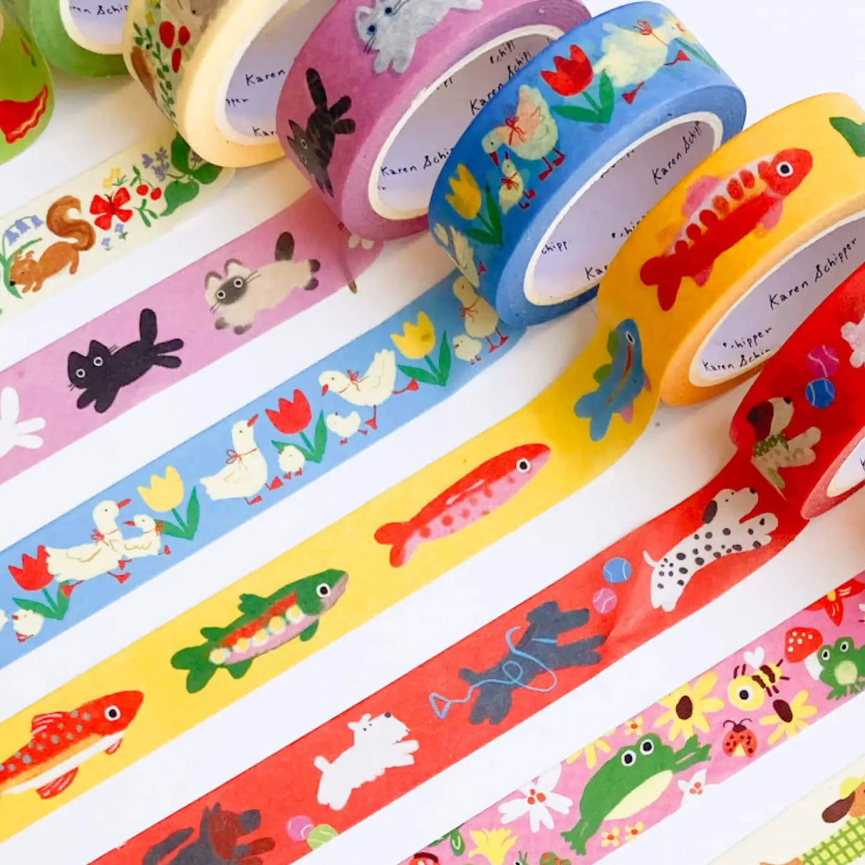 Long little dachshunds in bright sweaters and tiny caps give the Dachshund Dog Washi Tape a playful, personality-filled look. This Karen Schipper decorative paper tape is a fun pick for dog lovers, stationery shoppers, and anyone drawn to cheerful desk accessories.
Tape dimensions: 15mm x 10m
Each tape is approx. 1.75” x 1.75” x 0.65”
Packaged in clear plastic with two round branded stickers on each side of the roll
Designed in the USA, made in China
