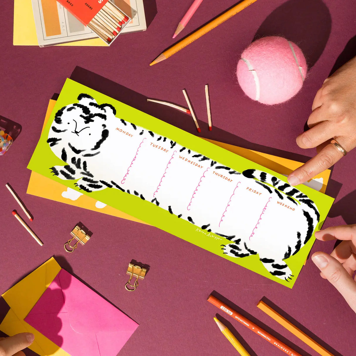 Karen Schipper Weekly Desk Planner - Tilda Tiger
Add bold, playful energy to weekly planning with the Tilda Tiger Desk Planner, an illustrated weekly planner pad featuring a striking tiger design with each section labeled for the days of the week. The long horizontal format makes it both eye-catching on a desk and practical for mapping out tasks, appointments, and weekly reminders.
It comes with 52 undated sheets, enough to last you the year.
Professionally printed full color
Size: 11.75 x 4.25 inches
52
