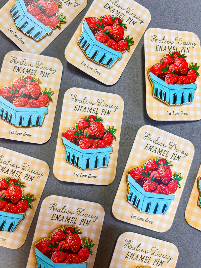 Strawberries Enamel Pin by Katie Daisy
A tiny treasure to pin on your jacket, tote, or favorite old flannel—each one a little love letter to country delights, small joys, and the art of noticing.