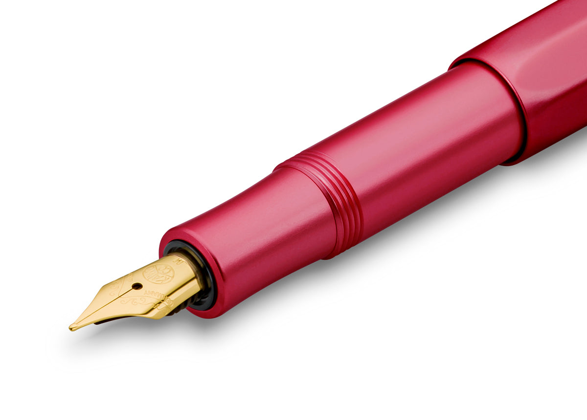 Just like the intricately cut facets of a ruby, the glossy polished surface of the fountain pen creates an exciting play of light on the octagonal shape. The refinement of the surface creates soft, rounded edges, which makes the writing instrument particularly comfortable to hold. A shadow engraving and the combination of aluminum with gold elements complements the elegant character of the pen. Included with this pen is a standard royal blue ink cartridge. 