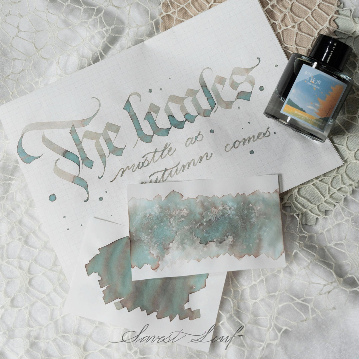 It’s a multi‑shading teal‑gray ink with subtle brown and silver undertones. When laid down heavily, it pools into a cool, misty turquoise; in lighter strokes, it fades toward warm taupe and soft gray, giving a natural, weathered look reminiscent of fallen leaves and foggy mornings. The shimmer is delicate — more of a frosted glint than a metallic flash — making it ideal for calligraphy or journaling that evokes autumn’s quiet elegance.
