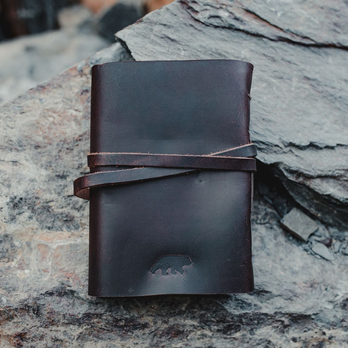 Kodiak Leather Traveler's Journal - Large
The Kodiak Traveler Journal is the perfect travel companion. Made with durable top grain leather, a leather wrap closure and handmade artisan paper this journal is the ultimate gift item for the world traveler or home-body.
• 110 blank pages
• Made with handmade artisan paper
• Top Grain Leather
• Dimensions: 8" x 6" x 1.75"