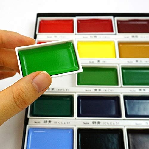 Take your artistic expression to the next level with the Zig Kuretake Gansai Tambi 18-Piece Watercolor Set.
These high-quality Japanese traditional solid watercolors offer stunning finishes, ideal for artists and crafters with a keen eye for detail. Their water-based pigments blend beautifully and create luminous effects, making them perfect for sketching, illustrating, and adding refined touches to mixed media projects.
This set contains White, Black, Cadmium Scarlet, Red, Rose Madder, Rose Madder