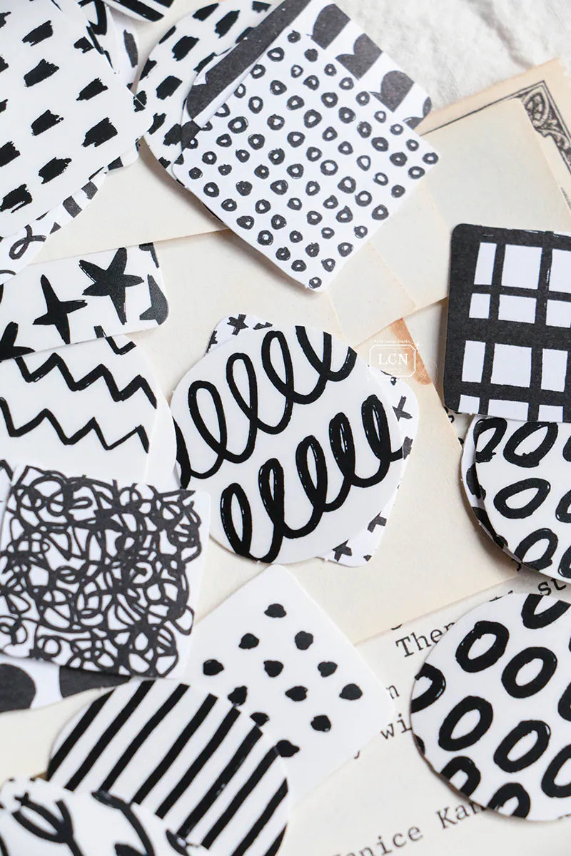 A mini package box full of black and white stickers!
How cute is that!
It has everything: a fragile sticker, shipping label, and even an invoice!
That invoice is also a sticker!