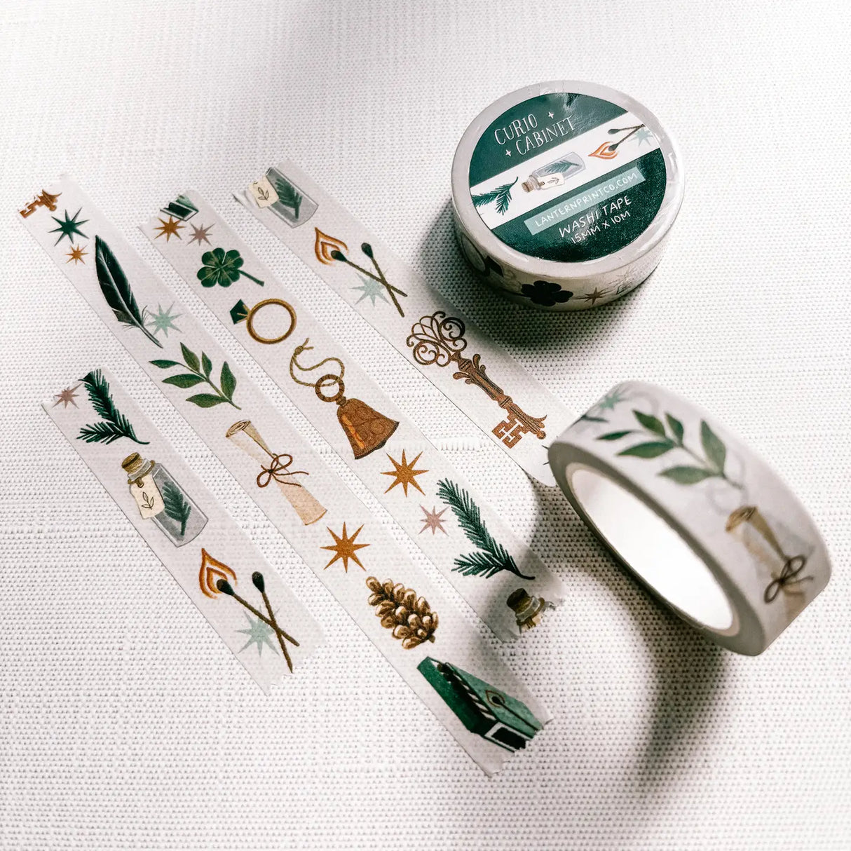 Removable Washi craft tape for journaling and gift wrapping; featuring curios, specimens, and trinkets on an off-white background.
15mm x 10m
Shrink wrap packaging with label
