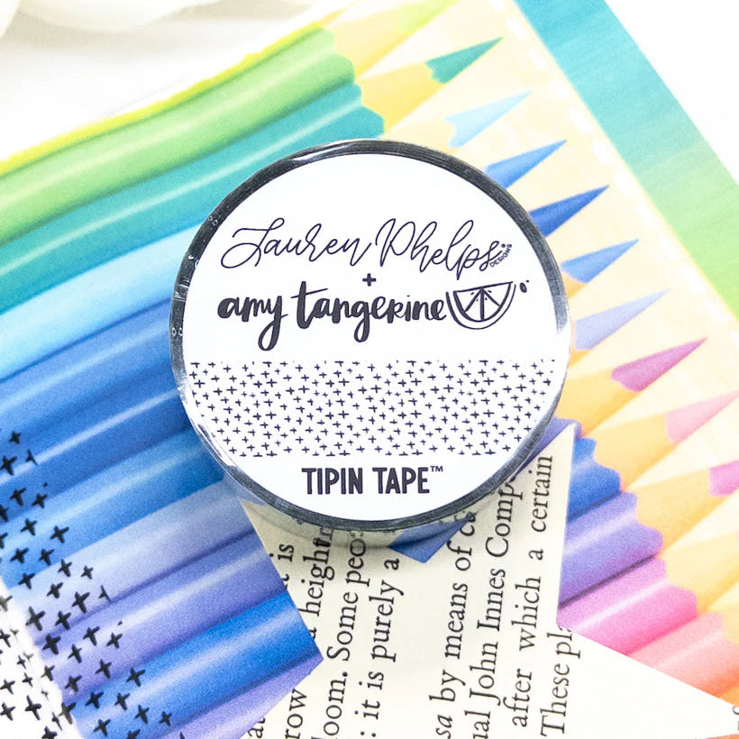 Do you love adding interactive elements to your scrapbook layouts like photos, journaling cards, patterned paper, ephemera, and keepsakes, but want a clean, professional way to attach them without bulky adhesives or visible hinges?
Tip In Tape™ was designed for exactly that.
Tip In Tape™ is a clear matte PET tape created for adding interactive elements to scrapbook pages and paper crafting projects with precision and ease. It allows you to create flip-ups, tip-ins, layered details, and movable elements wh