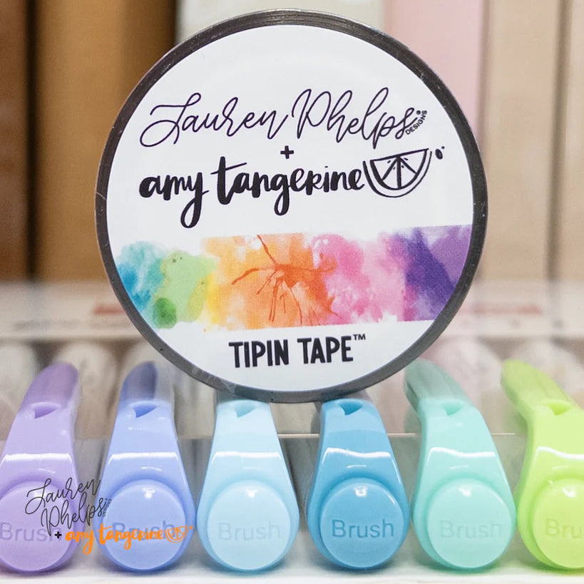 Do you love adding interactive elements to your scrapbook layouts like photos, journaling cards, patterned paper, ephemera, and keepsakes, but want a clean, professional way to attach them without bulky adhesives or visible hinges?
Tip In Tape™ was designed for exactly that.
Tip In Tape™ is a clear matte PET tape created for adding interactive elements to scrapbook pages and paper crafting projects with precision and ease. It allows you to create flip-ups, tip-ins, layered details, and movable elements wh