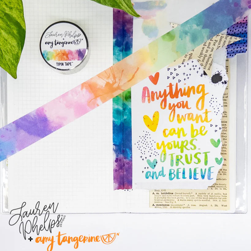 Do you love adding interactive elements to your scrapbook layouts like photos, journaling cards, patterned paper, ephemera, and keepsakes, but want a clean, professional way to attach them without bulky adhesives or visible hinges?
Tip In Tape™ was designed for exactly that.
Tip In Tape™ is a clear matte PET tape created for adding interactive elements to scrapbook pages and paper crafting projects with precision and ease. It allows you to create flip-ups, tip-ins, layered details, and movable elements wh