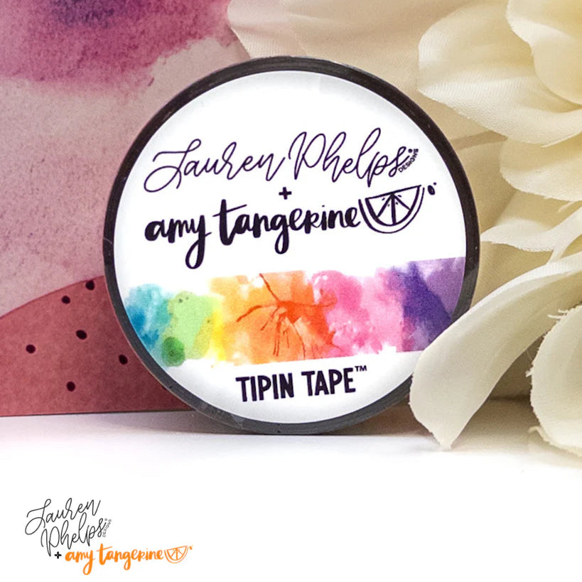 Do you love adding interactive elements to your scrapbook layouts like photos, journaling cards, patterned paper, ephemera, and keepsakes, but want a clean, professional way to attach them without bulky adhesives or visible hinges?
Tip In Tape™ was designed for exactly that.
Tip In Tape™ is a clear matte PET tape created for adding interactive elements to scrapbook pages and paper crafting projects with precision and ease. It allows you to create flip-ups, tip-ins, layered details, and movable elements wh