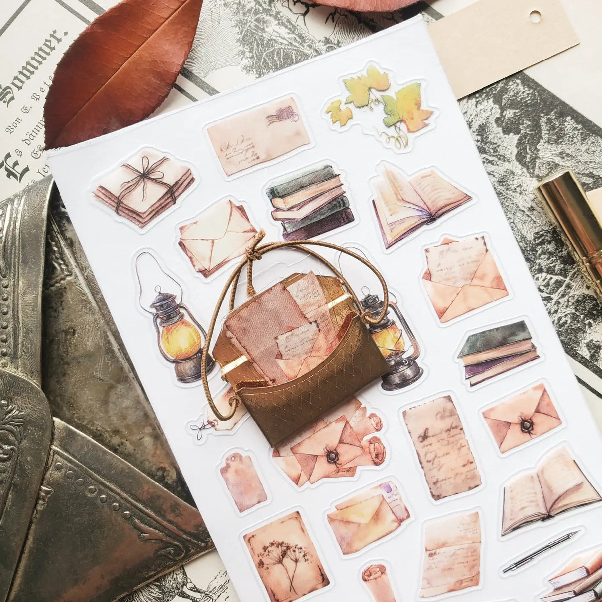 📜🕯️ A stack of letters waits to be opened in @jeannadano’s vintage-inspired stationery set. Weathered envelopes, handwritten notes, and well-loved books, all gathered together as if for a quiet evening of reading and reflection. With delicate paper textures and warm, timeworn tones, this charming set captures the feeling of sunlight on antique paper. Art by: @jeannadano
Top Coating: None
Adhesive Layer: Paper
Backing Layer: Paper
6.69" x 3.54".
Weight - 0.03lbs.
1 sheet included 