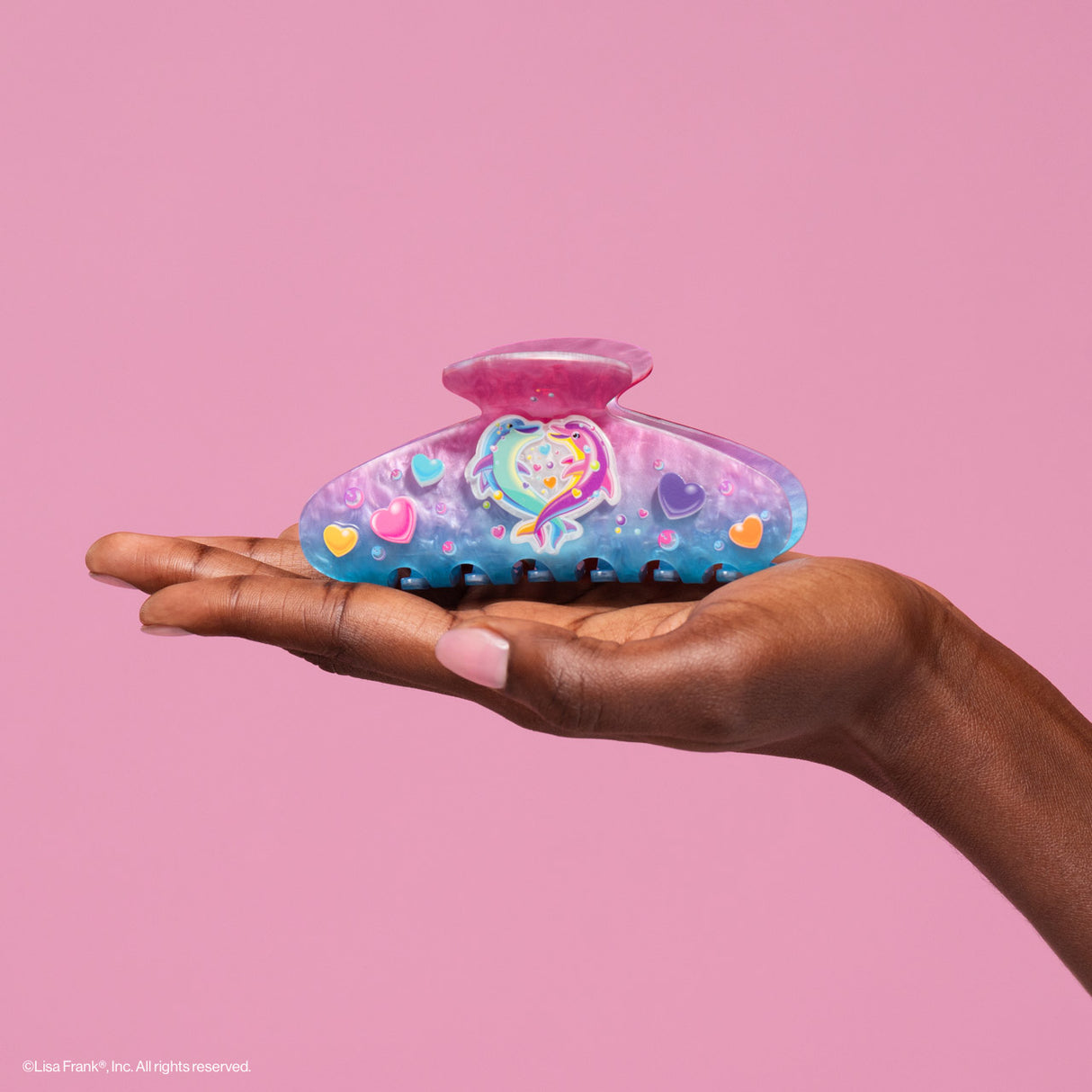 Add a refreshing touch to your style inspired by Lisa Frank® funny Dancing Dolphins™
Create an easy half-up do or clip your hair all the way up and back. Perfect for every day and elevating your everyday look!