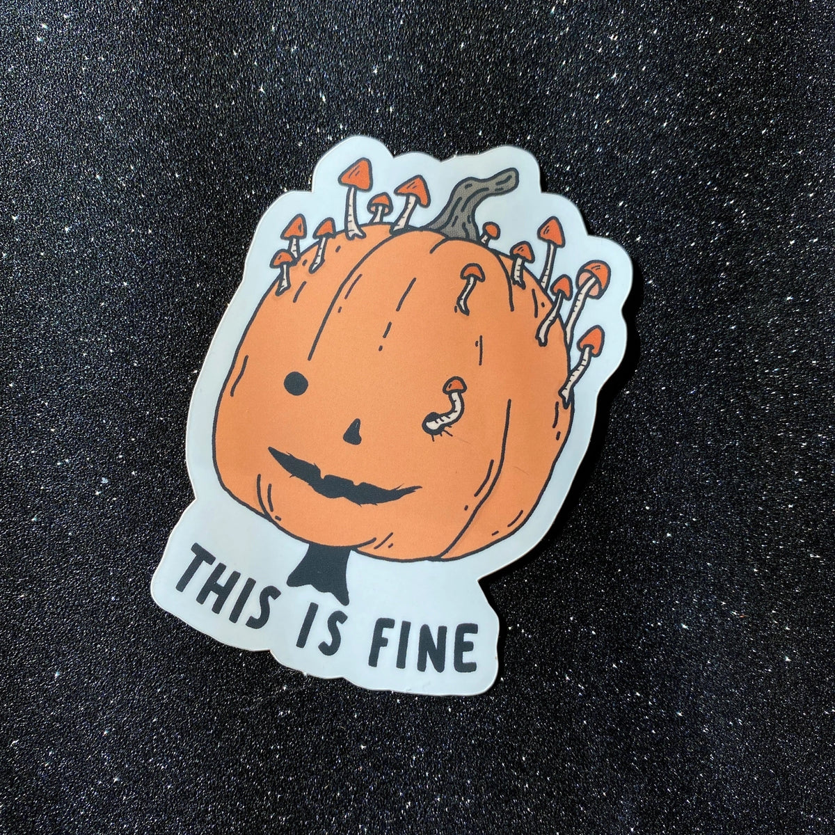 Little Spooky Studio - This Is Fine Pumpkin Vinyl Sticker
3 inch matte sticker of a rotting mushroomy pumpkin with the text "This is fine." underneath.