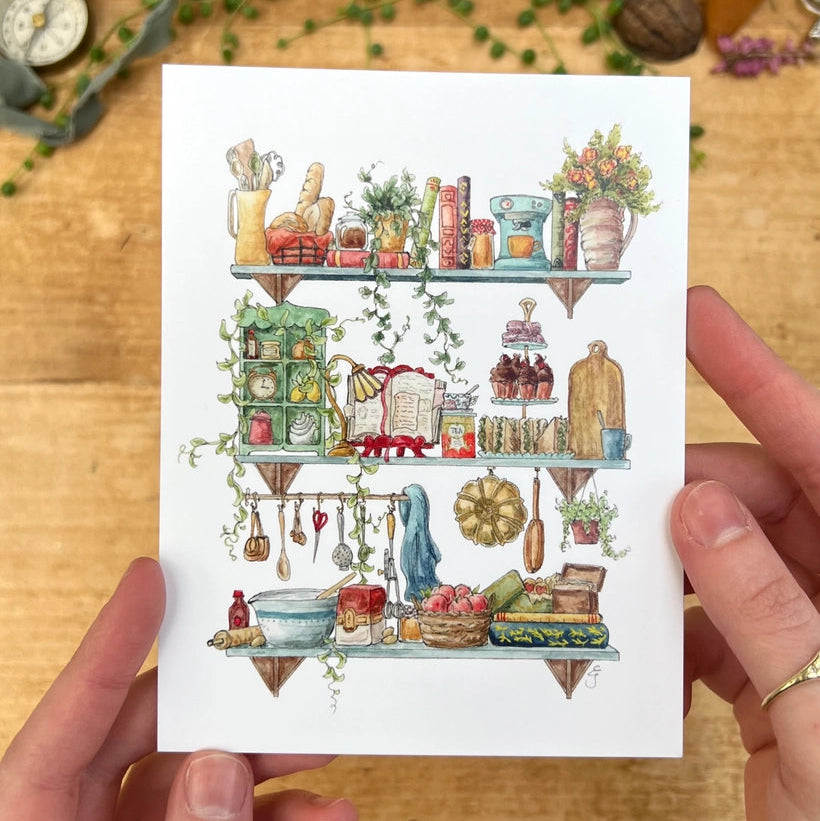Postcard featuring my original watercolor and ink illustration of the vintage oddities and books tucked away in the shelves of a vintage baker, including a well-loved recipe book, a mixing bowl, and a tower of tasty treats.
• Printed on high quality card stock
• Each postcard measures 4.25 x 5.5" (A2)