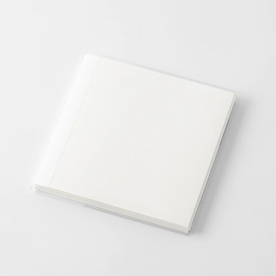 A transparent cover that fits snugly around your MD Notebook
This is a special cover that gently wraps your MD Notebook. The transparent cover protects the notebook from dirt without ruining its appearance.
It subtly protects your notebook from water and dirt without interfering with its characteristics. If you put the cover on with the glassine paper still wrapped around it, the inorganic feel of the vinyl will be softened.
Because it is transparent, you can enjoy the cover design, illustrations, and writ