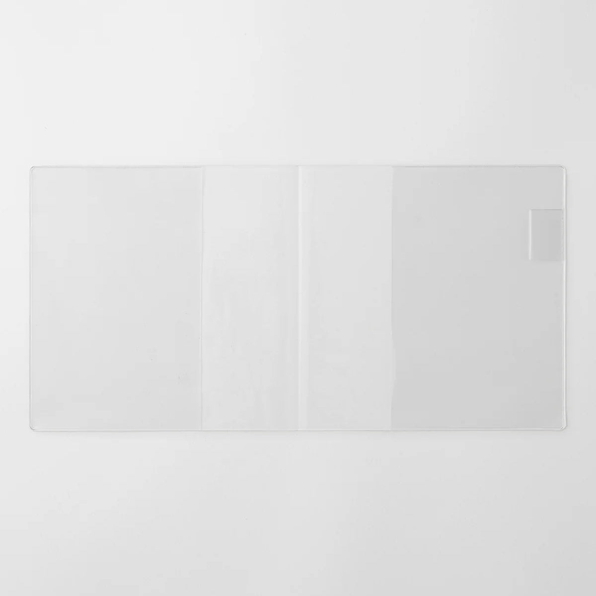 A transparent cover that fits snugly around your MD Notebook
This is a special cover that gently wraps your MD Notebook. The transparent cover protects the notebook from dirt without ruining its appearance.
It subtly protects your notebook from water and dirt without interfering with its characteristics. If you put the cover on with the glassine paper still wrapped around it, the inorganic feel of the vinyl will be softened.
Because it is transparent, you can enjoy the cover design, illustrations, and writ