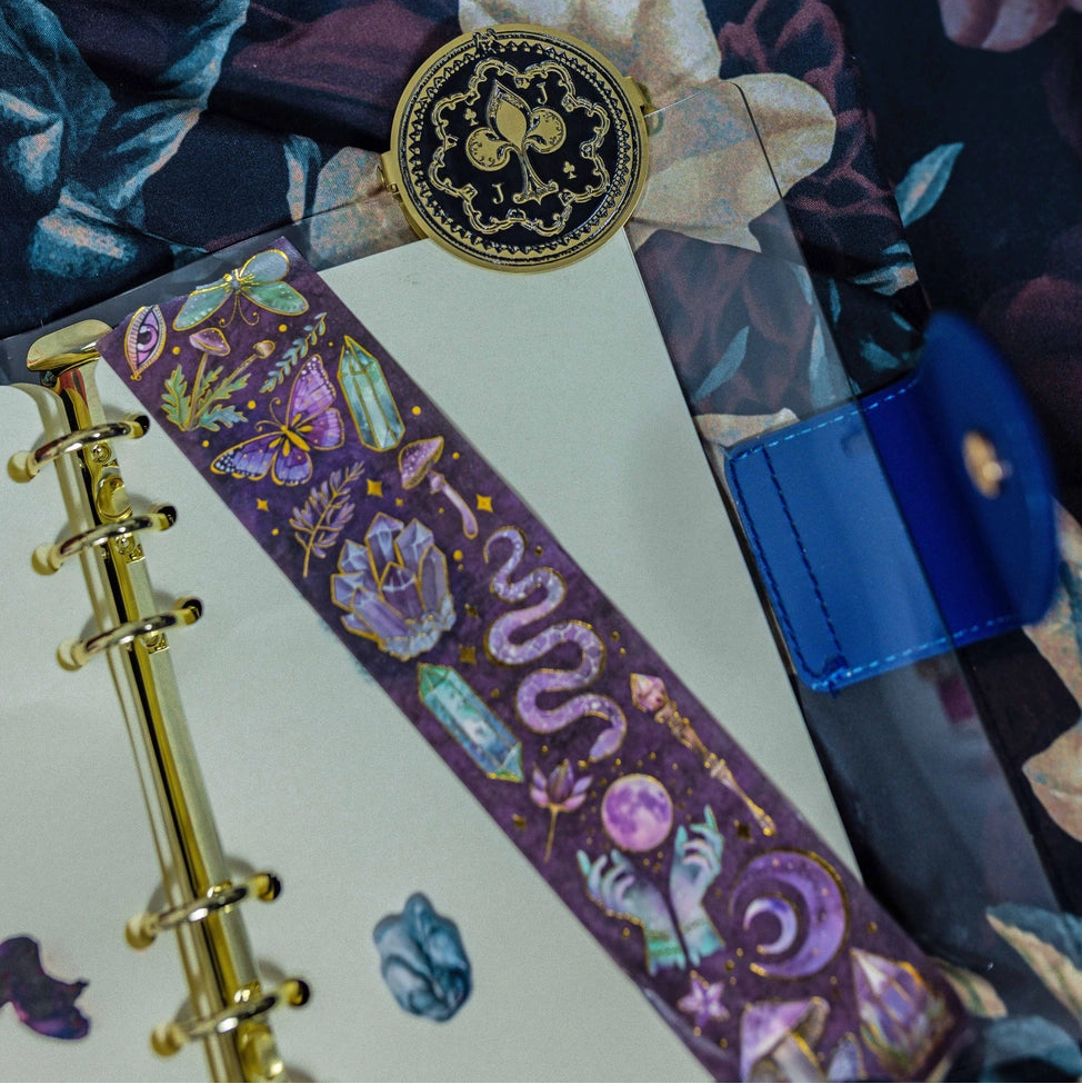 Add a touch of magical elegance to your crafts with this stunning foil washi tape, exclusively designed by CoraCreaCrafts. Featuring intricate magical and whimsical designs, this washi tape is as versatile as it is beautiful: ideal for bullet journaling, card making, or enhancing any creative project.
Measurements: 3 cm wide x 5 m long