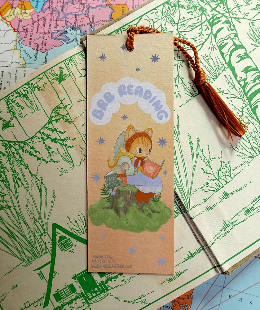Marika Paz Illustration - BRB Reading Bookmark
Three little friends read together. Be Right Back, Reading! Same artwork on both sides.
Printed on heavy cardstock and comes with a tassel, these bookmarks measure 2x6 inches.
Printed in USA