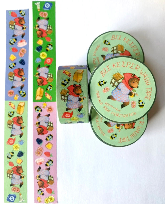 A Bee Keeper bear keeps watch over their bees. Bee Keeper Washi Tape.
Each tape rotates through four designs on four different colors.
Tape is 20mm x 10m.
Includes one roll of washi tape