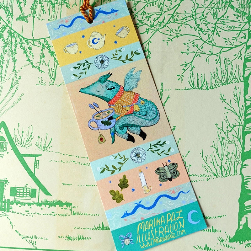 A dragon on an adventure! This dragon is great at keeping your place in your favorite book. Perfect for book lovers! This bookmark has the same image on both sides.
Printed on heavy cardstock and comes with a tassel, these bookmarks measure 2x6 inches.
Printed in USA