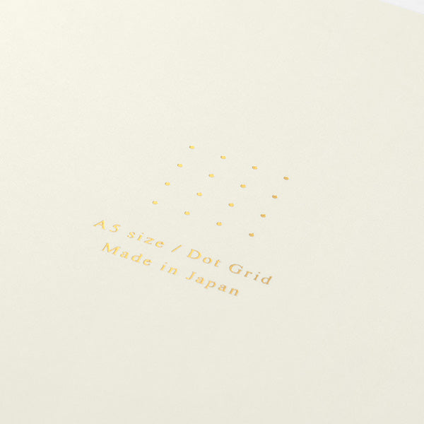 Stitcher-bound notebook for casual use. The inner paper is made of paper that matches the cover, so you can enjoy your favorite paper and pen color combination.
The popular 5mm dot graph inner paper is "MD paper" that is easy to write on regardless of pen. The dot grid serves as a subtle guide when writing letters and illustrations, and makes it easier to apply stickers and photos neatly.
A calm design that is easy for adults to hold. The dull color cover has a discreet foil stamping p