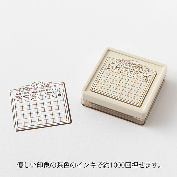 Midori - Pre-inked Stamp Soft Color Calendar
This is a brown ink (soft color type) that blends well with the colors and decorations of writing instruments. This is a permeable stamp type that allows you to stamp fine patterns beautifully, color over it, or write records and messages. This is a Monday-start format calendar that lets you write your own date or color it for fun.
Since it uses oil-based ink, it won't bleed even when you paint over the stamp with a water-based marker. You can sta