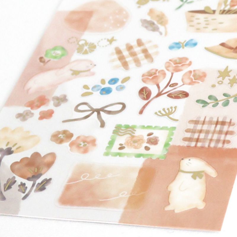 Sheet of decorative stickers with floral, bunny, and bow designs on a white background.