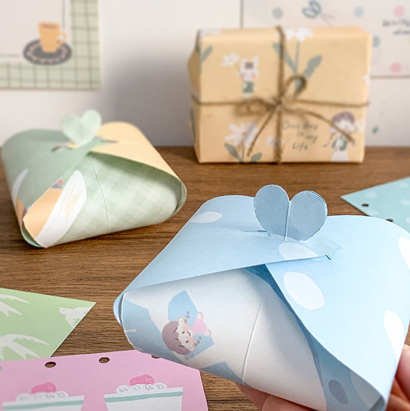 Molinta - Gentle Dreams A5 Colored Notepad
Enjoy 5 sets of 12 different designs that total to 60 sheets that can be used for various purposes such as gift wrapping or making cute collages in your journal!
Specifications: 148mmx210mm
Material: 100g white kraft paper
Full color pages inside
Number of pages: 60