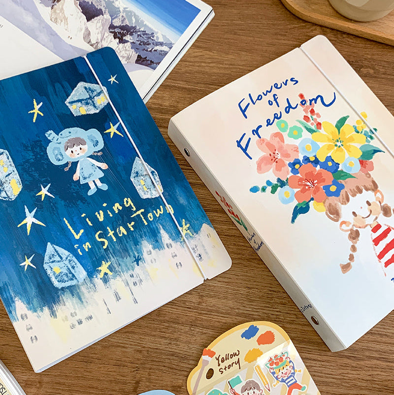 Molinta A5 Organizing Binder - Flowers of Freedom
Designed in a six‑ring format, this binder is perfect for organizing ephemera, sticker sheets, journaling inserts, and creative plans. This A5 binder, gives you plenty of room to store larger pages, decorative layouts, and all the bits and pieces that make your journaling uniquely yours. Whether you're building sticker albums, creating themed spreads, or keeping your notes tidy, this binder offers a beautiful and functional way to keep everything in on