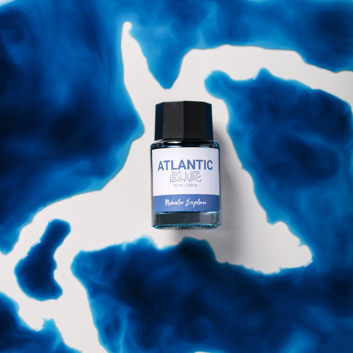 The new Nahvalur Explorer ink collection is comprised of four fountain pen inks—Dark Forest, Atlantic Blue, Orchid Flower, and Mango Sorbet—each inspired by one of the original Nahvalur Explorer Plus fountain pens. The box packaging features a lighthouse illustration in the ink color. The 20-ml round glass bottles have a hexagonal cap, and inks are pH neutral and fast drying.