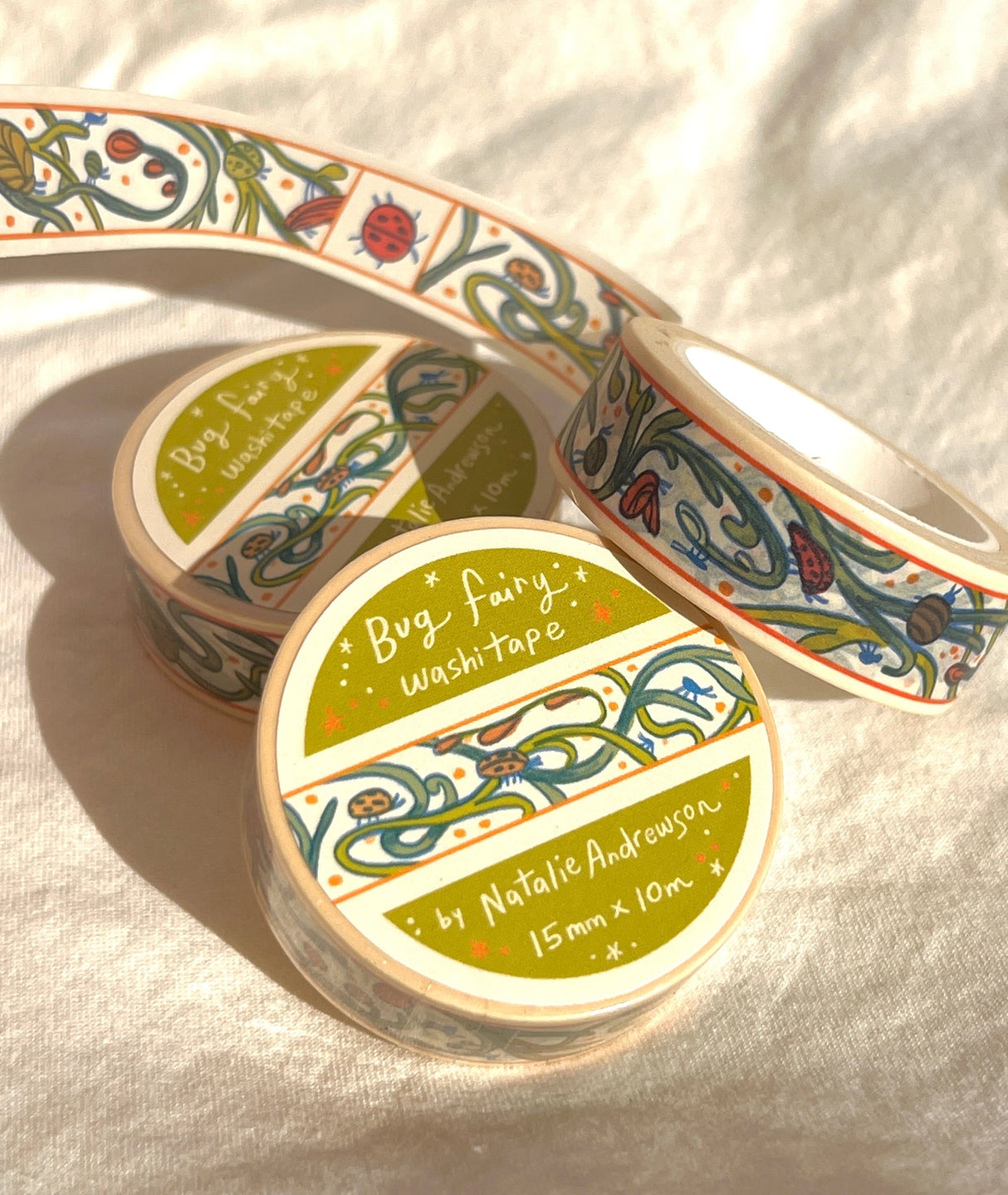 This washi tape features little bugs hidden in vines! Taken from the borders of my Bug Fairy print.
This roll is 15mm wide x 10m of paper tape. Washi tape is super durable and flexible. It tears easily and can be safely applied to a variety of surfaces; it doesn’t leave a sticky residue behind, making it especially ideal for stationery and hanging prints temporarily.