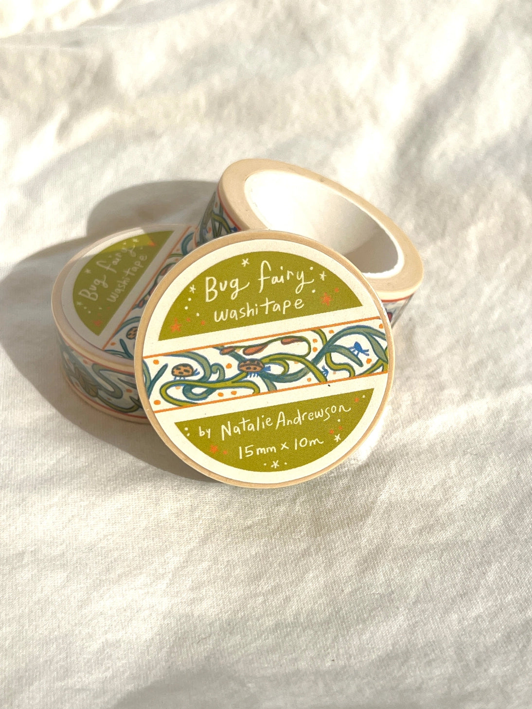 This washi tape features little bugs hidden in vines! Taken from the borders of my Bug Fairy print.
This roll is 15mm wide x 10m of paper tape. Washi tape is super durable and flexible. It tears easily and can be safely applied to a variety of surfaces; it doesn’t leave a sticky residue behind, making it especially ideal for stationery and hanging prints temporarily.