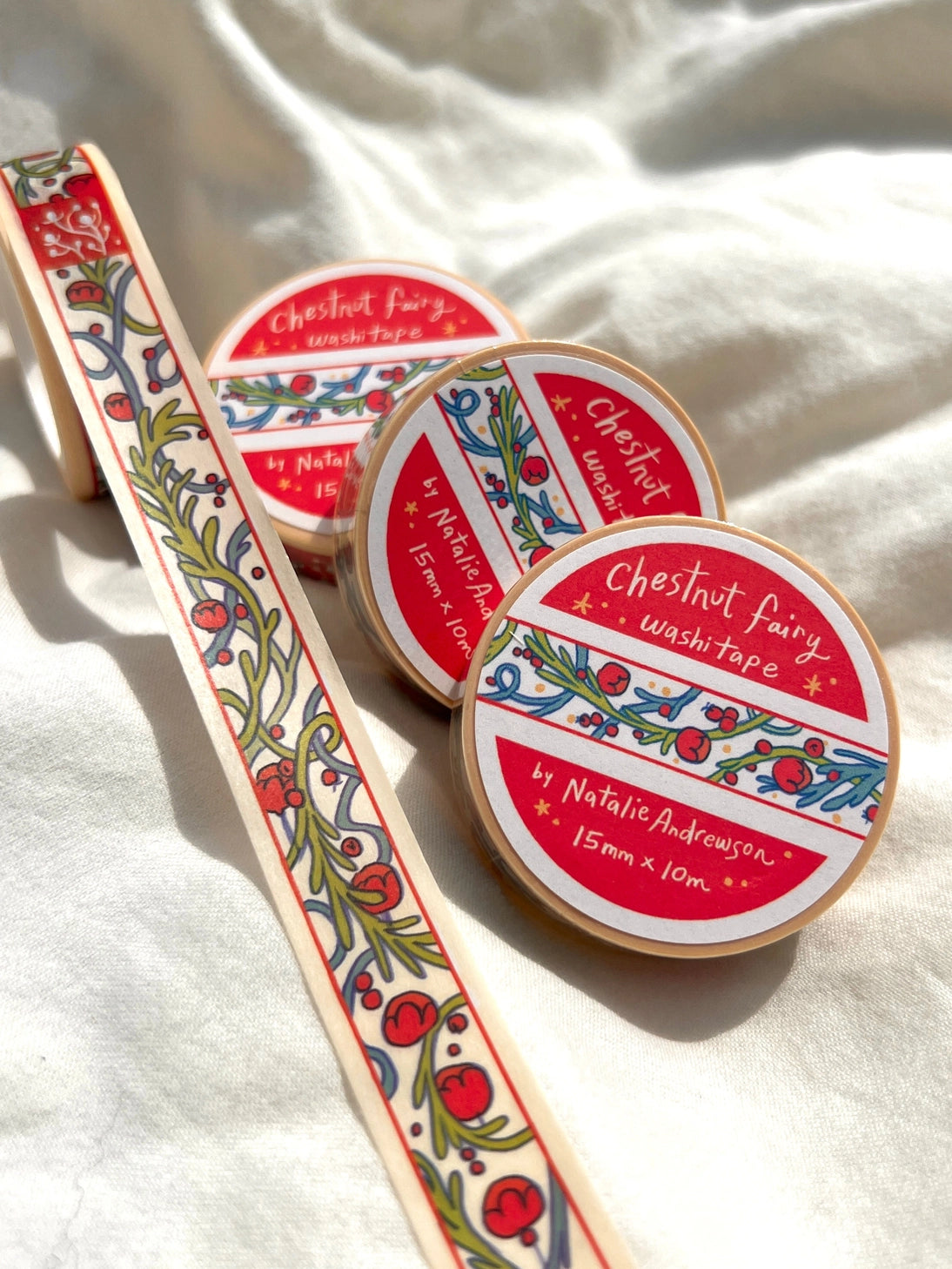 This washi tape was designed from my Chestnut Fairy Riso print! Looks like classic book art decorations with a vibrant red block separating each section.
This roll is 15mm wide x 10m of paper tape. Washi tape is super durable and flexible. It tears easily and can be safely applied to a variety of surfaces; it doesn’t leave a sticky residue behind, making it especially ideal for stationery and hanging prints temporarily.