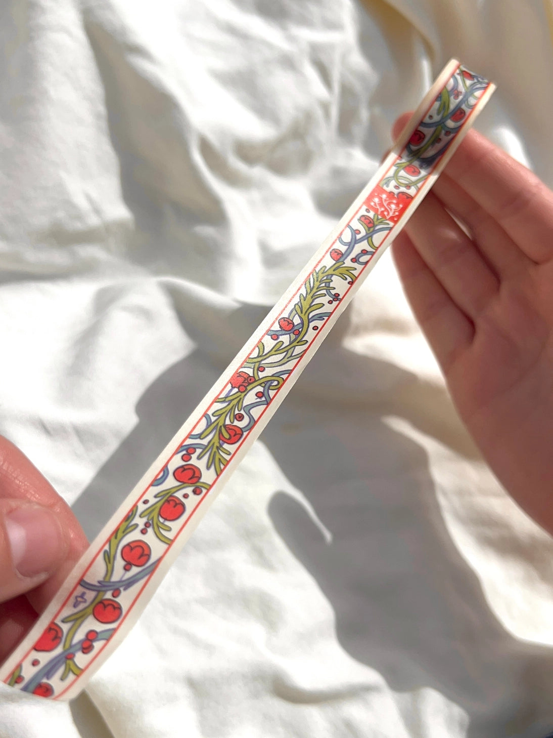 This washi tape was designed from my Chestnut Fairy Riso print! Looks like classic book art decorations with a vibrant red block separating each section.
This roll is 15mm wide x 10m of paper tape. Washi tape is super durable and flexible. It tears easily and can be safely applied to a variety of surfaces; it doesn’t leave a sticky residue behind, making it especially ideal for stationery and hanging prints temporarily.