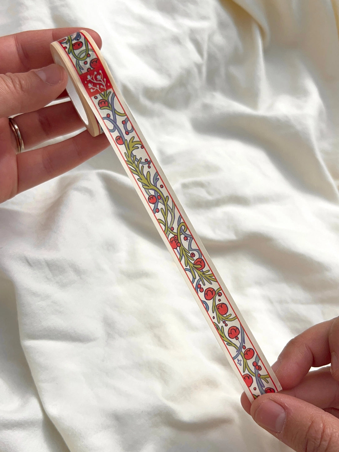 This washi tape was designed from my Chestnut Fairy Riso print! Looks like classic book art decorations with a vibrant red block separating each section.
This roll is 15mm wide x 10m of paper tape. Washi tape is super durable and flexible. It tears easily and can be safely applied to a variety of surfaces; it doesn’t leave a sticky residue behind, making it especially ideal for stationery and hanging prints temporarily.