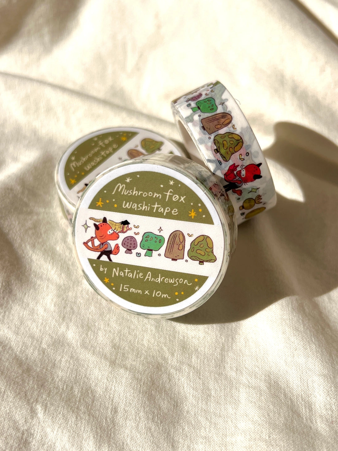 This washi tape features a little fox on their adventures through the mushroomy forest!
This roll is 15mm wide x 10m of paper tape. Washi tape is super durable and flexible. It tears easily and can be safely applied to a variety of surfaces; it doesn’t leave a sticky residue behind, making it especially ideal for stationery and hanging prints temporarily.