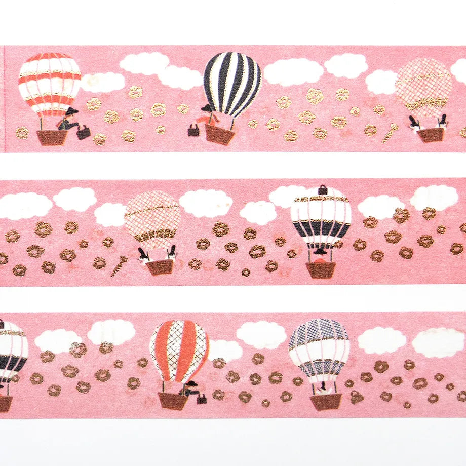 Ride a balloon with your favorite pattern and embark on a fun sky journey!
The fluffy flowers floating in the sky are also adorable. Cut short to use as stickers, or as a pop point in wrapping or decoration.
✨ Product Features
Gold foil stamping for a subtle, elegant shine
Perfect for decorating planners, journals, cards, gifts, and scrapbooks
High‑quality Cozyca Products washi tape
Size: 20 mm × 5 m