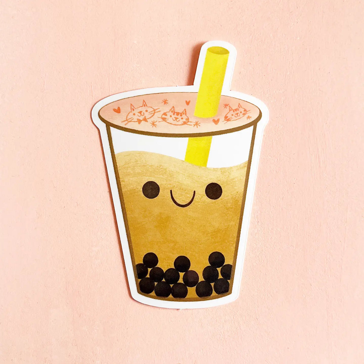 Cartoon bubble tea with a smiley face on a pink background