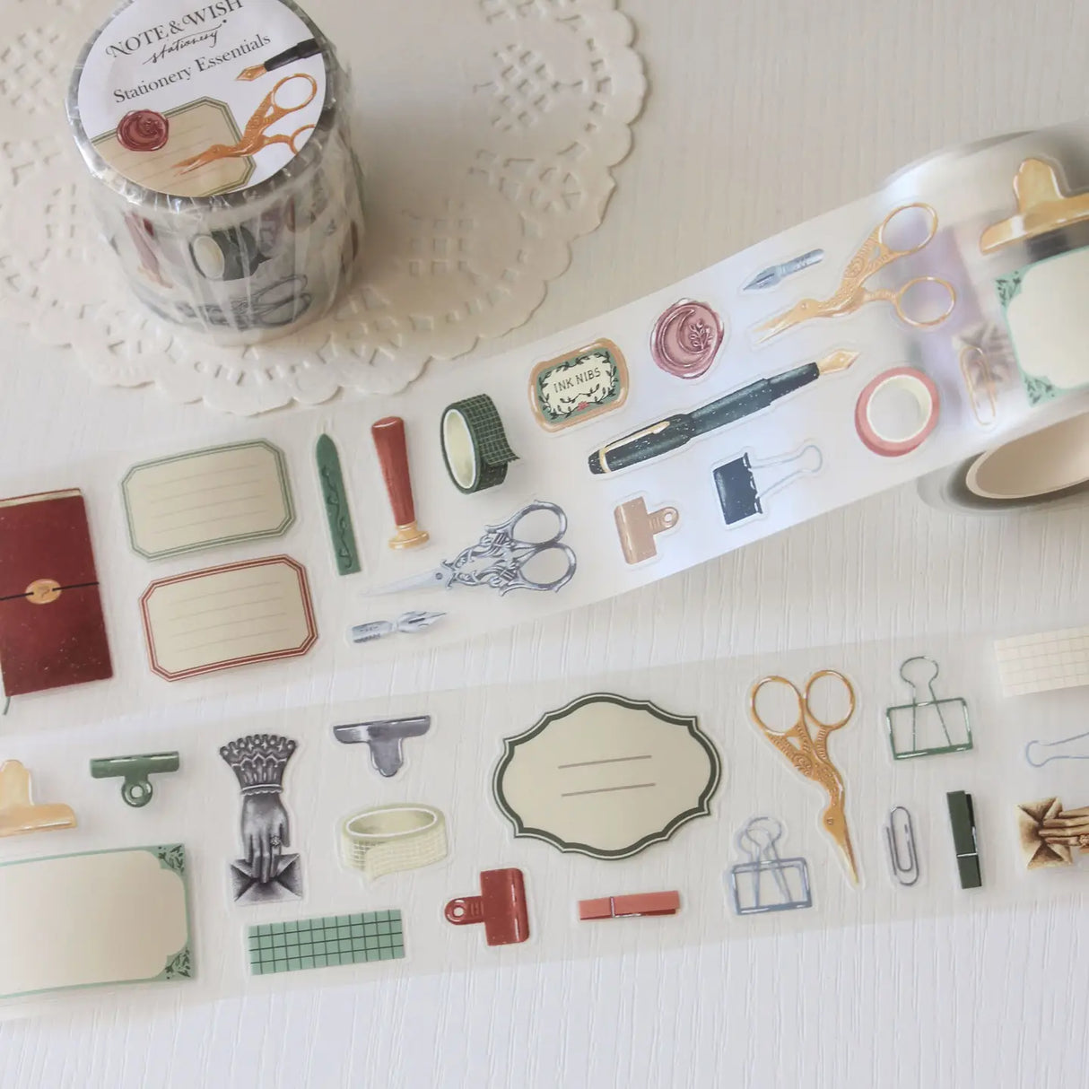 An updated version of our Stationery Essentials PET tape, now with a longer 50cm designer loop for even more creative possibilities.
This PET tape features hand-painted illustrations of vintage stationery such as wax seal stamps, fountain pens and ornate scissors. Designed by Rebecca and pre-cut for effortless use, it's perfect for journaling, collaging and adding a vintage aesthetic to any creative project.
Extra wide at 50mm with a matt transparent finish that layers cleanly over any background. No scis
