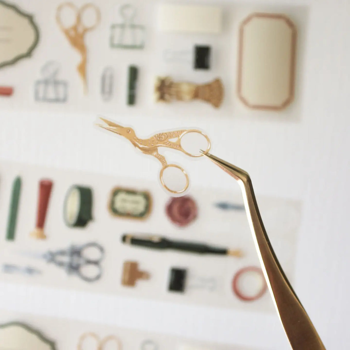 An updated version of our Stationery Essentials PET tape, now with a longer 50cm designer loop for even more creative possibilities.
This PET tape features hand-painted illustrations of vintage stationery such as wax seal stamps, fountain pens and ornate scissors. Designed by Rebecca and pre-cut for effortless use, it's perfect for journaling, collaging and adding a vintage aesthetic to any creative project.
Extra wide at 50mm with a matt transparent finish that layers cleanly over any background. No scis
