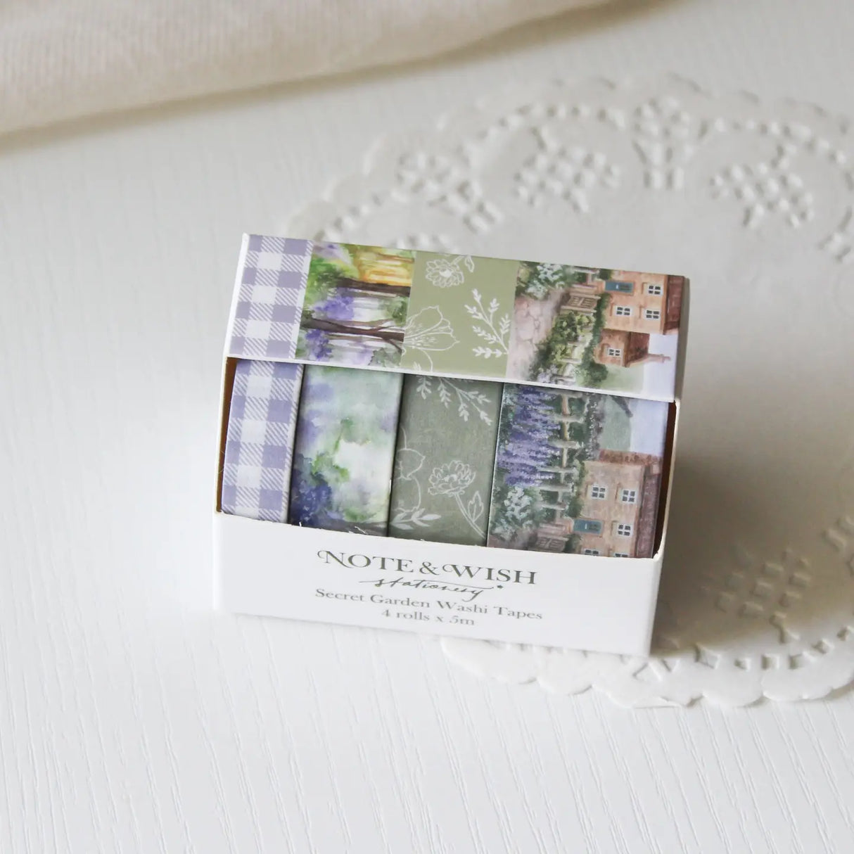 This beautiful washi tape gift set is designed for journalers, nature lovers and stationery lovers who find beauty in the quiet corners of the British countryside. Featuring original watercolour paintings by Rebecca, this set is inspired by walks through a bluebell wood and a secret garden in full bloom.
The two designs included:
Bluebell Woods — a hand-painted watercolour scene of a bluebell wood - 15mm x 5m
Secret Garden — a beautiful cottage and garden scene, hand-painted in soft watercolours - 2