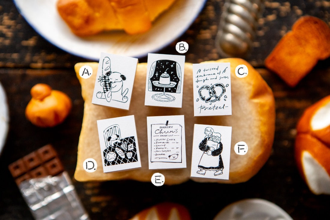 OURS Studio "The Gift" Bakery Rubber Stamp Series Pumpkin with black and white illustrations on a dark surface with pumpkins and a guitar.