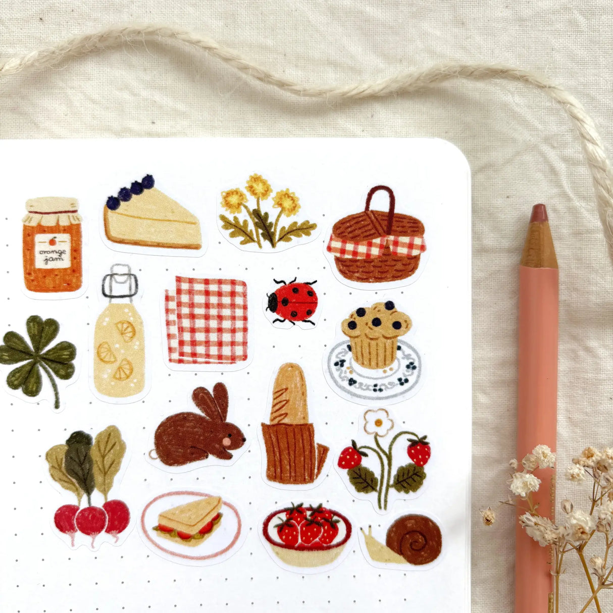 OchMonika Spring Picnic Sticker Sheet
A matte paper sticker sheet filled with cozy, hand-drawn illustrations, perfect for planners, journals, or scrapbooking. It features a outdoor picnic and spring theme, making it a perfect fit for nature lovers and gift boutiques. All designs are lovingly created by Monika Szczerbińska.