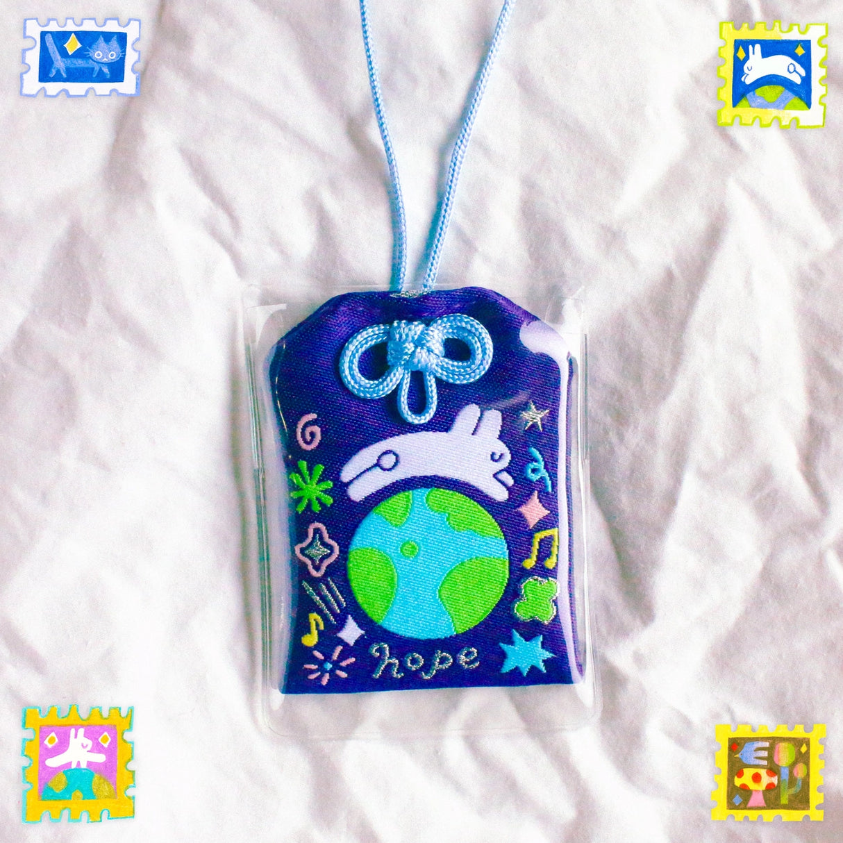 2x2.5 omamori charm with a 8 inch string.
An omamori is a Japanese charm that provides protection and luck!