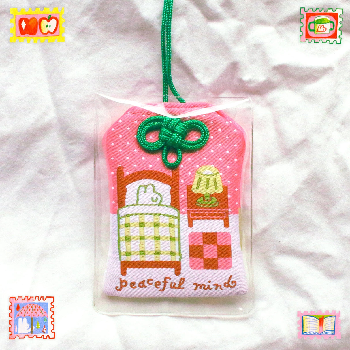 2x2.5 omamori charm with a 8 inch string.
An omamori is a Japanese charm that provides protection and luck!